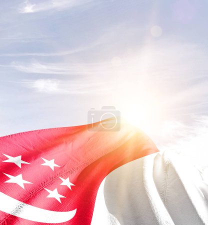 Photo for Singapore waving flag against blue sky with clouds - Royalty Free Image