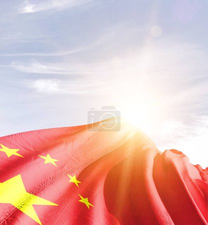 Photo for China waving flag against blue sky with clouds - Royalty Free Image