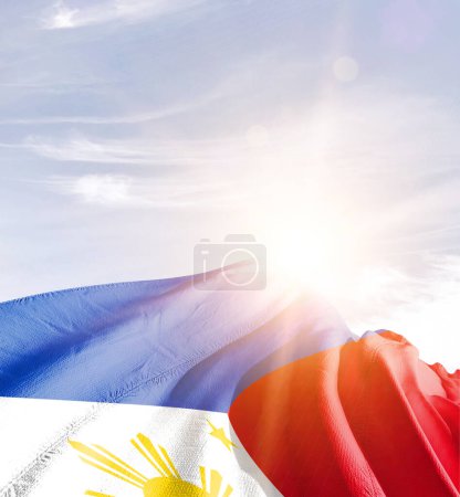 Foto de Philippines waving flag in beautiful sky. - Imagen libre de derechos