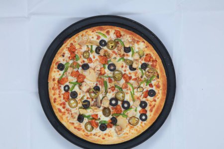 Téléchargez les photos : Un gros plan d'une délicieuse pizza - en image libre de droit