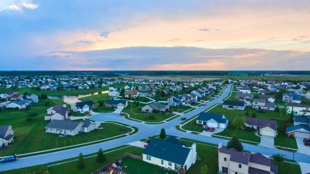 Image of Midwest American suburban neighborhood housing aerial at dusk