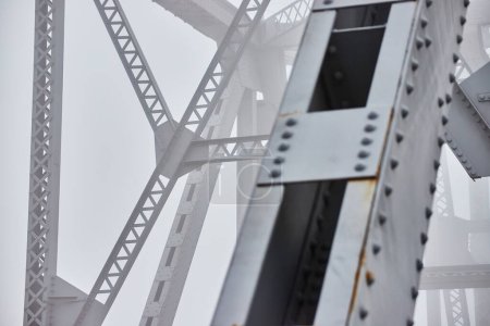 Photo for Image of Foggy morning detail of steel beams on bridge - Royalty Free Image