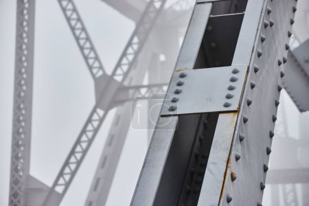 Photo for Image of Foggy morning detail of steel beams bridge with soft background - Royalty Free Image