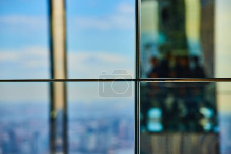Photo for Image of Abstract straight on glass reflection wall with dividing panels and soft blue lights - Royalty Free Image