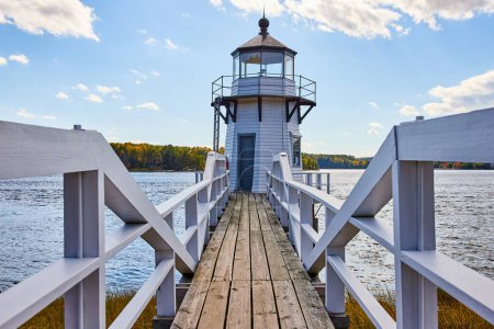 Photo for Image of White Maine lighthouse with wood boardwalk and railing - Royalty Free Image