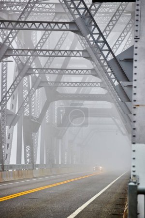 Photo for Image of Cars going down extremely foggy steel bridge from side - Royalty Free Image