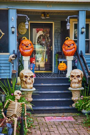 Photo for Image of Pumpkins and skeletons for Halloween decorate exterior of American house porch in New York - Royalty Free Image