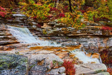 Photo for Image of Beautiful layers of rocks in river with cascading waterfalls and fall trees - Royalty Free Image