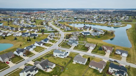 Photo for Image of Drone aerial of suburban Midwest American neighborhood houses with ponds - Royalty Free Image