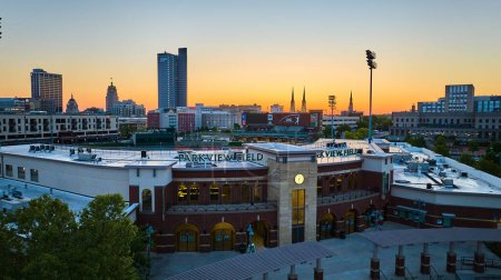 Photo for Image of Sunrise Parkview Field Downtown Fort Wayne city skyline cityscape aerial baseball stadium churches - Royalty Free Image