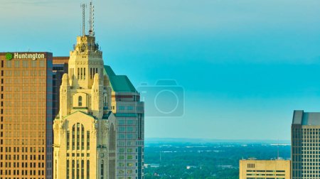 Photo for Image of Aerial tip of LeVeque Tower at sunrise and other skyscraper tops behind it - Royalty Free Image