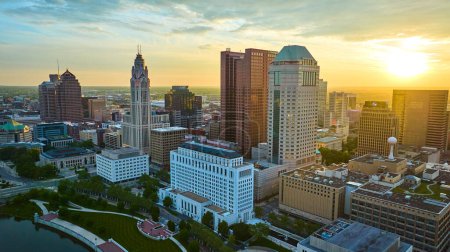 Photo for Image of Golden glow of sunrise behind four iconic Columbus Ohio skyscrapers aerial - Royalty Free Image