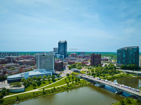 Photo for Image of Downtown Columbus Ohio with bridge and river leading away from heart of city aerial - Royalty Free Image