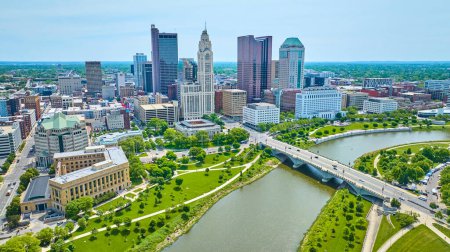 Photo for Image of Drone view downtown Columbus Ohio over Scioto River with bridge and distant skyscrapers - Royalty Free Image