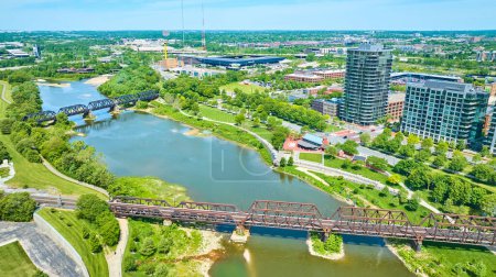 Photo for Image of Aerial train bridge and walking bridge over water near Columbus Ohio - Royalty Free Image