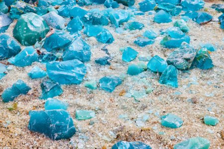 Photo for Image of White glass covered ground with large chunks of turquoise and sky blue shards - Royalty Free Image
