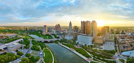 Photo for Image of Panorama golden glowing sun at sunrise behind skyscrapers of downtown Columbus Ohio aerial - Royalty Free Image