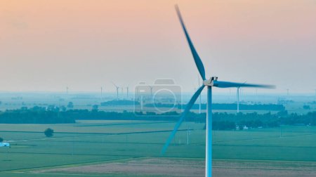 Photo for Image of Foggy morning with wind turbine in motion on wind farm aerial - Royalty Free Image