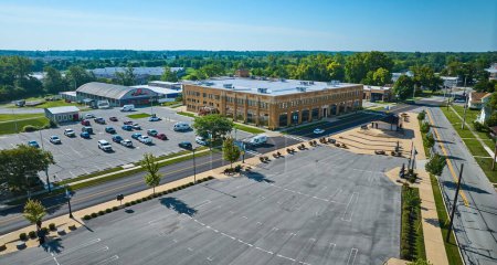 Photo for Image of Large empty parking lot and partially full parking lot aerial outside ACD Automobile Museum - Royalty Free Image