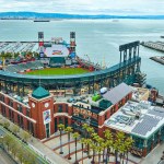Image of Aerial Oracle Park Willie Mays Gate entrance with ballpark and South Beach Harbor