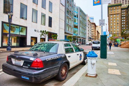 Photo for Image of SFPD patrol vehicle beside white and blue fire hydrant on touristy Union Square street, San Francisco, CA - Royalty Free Image