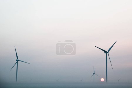 Photo for Tranquil wind turbines in a serene Ohio landscape, showcasing renewable energy and environmental harmony - Royalty Free Image