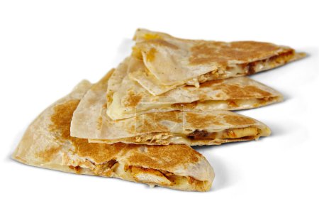 Photo for Deliciously Melting Quesadillas with Golden Crispy Tortillas - Mouth Watering Mexican comfort food shot from a side angle, highlighting layers of gooey cheese, flavorful filling, and char marks. - Royalty Free Image