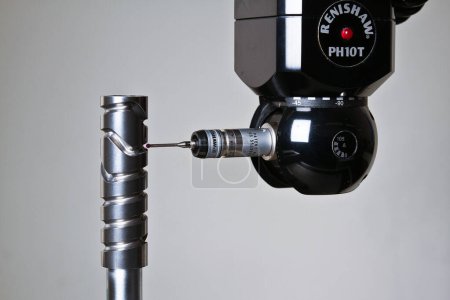Photo for Precision Engineering: Renishaw PH10T Probe Inspecting Metal Component in Fort Wayne, Indiana - Royalty Free Image