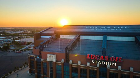 Photo for Golden hour aerial view of Lucas Oil Stadium, Indianapolis, capturing the tranquil twilight mood over the sports hub. - Royalty Free Image