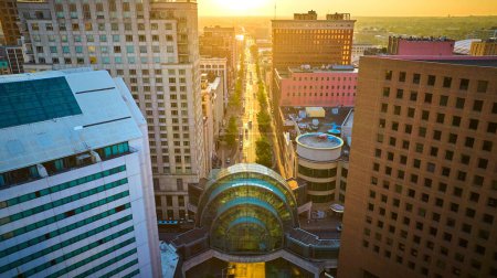 Photo for Golden hour over Indianapolis cityscape, featuring aerial view of urban architecture and Circle Center Mall, captured by DJI Mavic 3 drone - Royalty Free Image