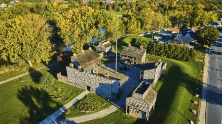 Photo for Aerial View of Historical Fort Wayne in Indiana, USA Showcasing Traditional Log-Built Structures Amid Modern Landscape - Royalty Free Image