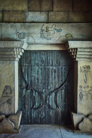 Photo for Ancient Bronze Door with Hieroglyphics in Stone Wall, Paradise Island, Nassau, Bahamas - Royalty Free Image