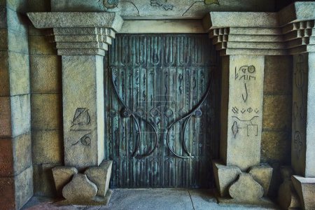 Photo for Ancient ornate iron door in stone portal, etched with mysterious symbols, on Paradise Island, Bahamas - Royalty Free Image