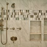 Modern Luxurious Bathroom in Michigan Home Showcases Opulent Brass Fixtures and Elegant Marble Tile Design, 2015