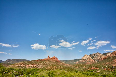 Sedonas Vibrant Red Rock Formations Towering Over Lush Forest under Azure Blue Sky, Arizona, 2016