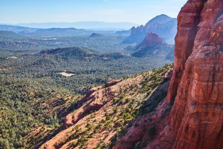 Photo for Breathtaking aerial view of vibrant red rock formations, lush greenery, and distant mountain ridges in sunny Sedona, Arizona, 2016 - Royalty Free Image