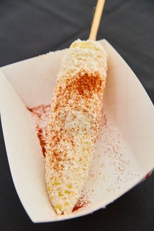 Vibrant close-up of traditional Mexican Elote street food served in Fort Wayne, Indiana during Cinco de Mayo celebrations in 2017