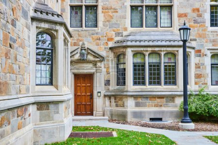 Classic architecture of the Law Quadrangle at University of Michigan, showcasing intricate stonework and tranquil campus environment