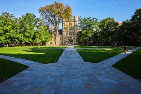 Photo for Serene morning at the historic Law Quadrangle, University of Michigan, Ann Arbor, showcasing traditional academic architecture and lush greenery. - Royalty Free Image