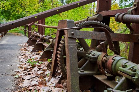 Rusted Mechanical Assembly in Nature, Homer Michigan, Emphasizing Decay and Intersection of Industrial and Natural Worlds