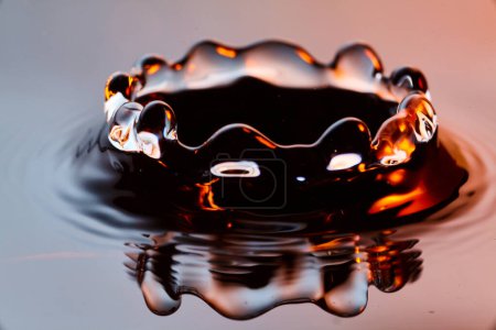 Elegant Water Droplet Splash in Warm Lighting, High-Speed Photography, Indiana 2017