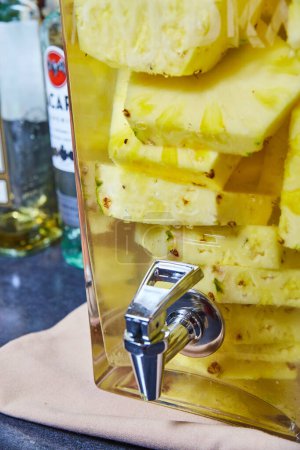 Vibrant Pineapple Infused Drink in Dispenser at a Bar in Fort Wayne, Indiana, 2017