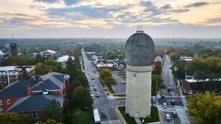 Photo for Aerial Sunrise View of Historic Ypsilanti Water Tower Amidst Traditional Structures in a Quiet Michigan Town - Royalty Free Image
