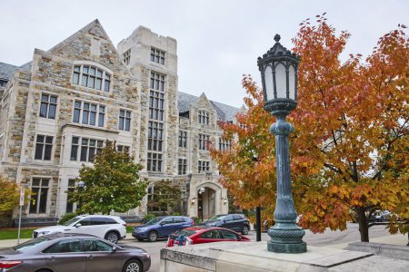 Photo for Gothic-style University of Michigan Law Quadrangle on an autumn day, showcasing vibrant fall colors, intricate stonework, and the scholarly atmosphere. - Royalty Free Image