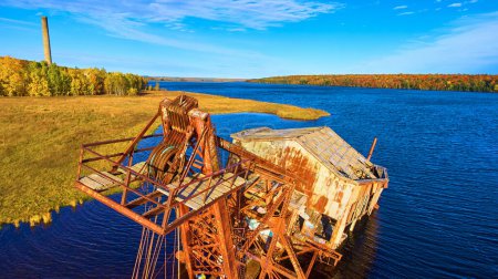 Abandoned Industrial Decay Amidst Vibrant Autumn Foliage in Houghton, Michigan, Captured by Aerial Drone