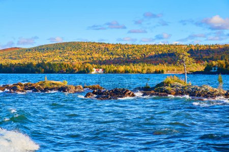 Autumnal Splendor at Eagle Harbor: A Solitary Lighthouse Amidst Fall Foliage on Lake Superior, Michigan, 2017
