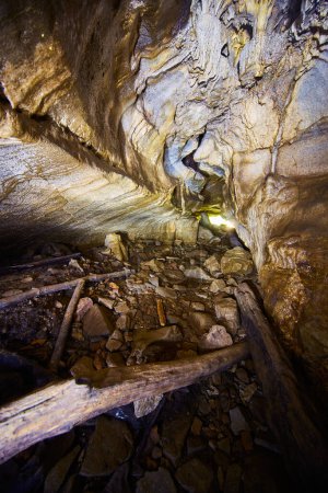 Interior of McCormicks Creek Falls Cave, Indiana, depicting rugged geological formations and a journey into the untouched beauty of nature.