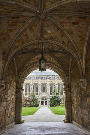 Gothic archway revealing historic University of Michigan Law Quadrangle, symbolizing education and history