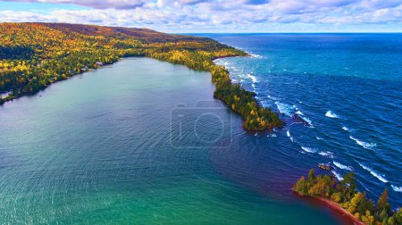 Aerial View of Autumn Forest Meeting Turquoise Bay and Rugged Coastline, Copper Harbor, Michigan