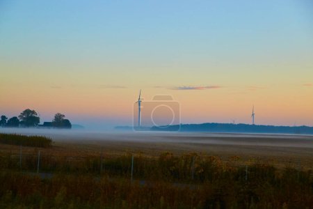 2017 Autumn Dawn over a Sustainable Michigan Farm with Wind Turbines, a Serene Foggy Landscape